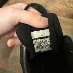 jordan 11 , black , white , and pink.